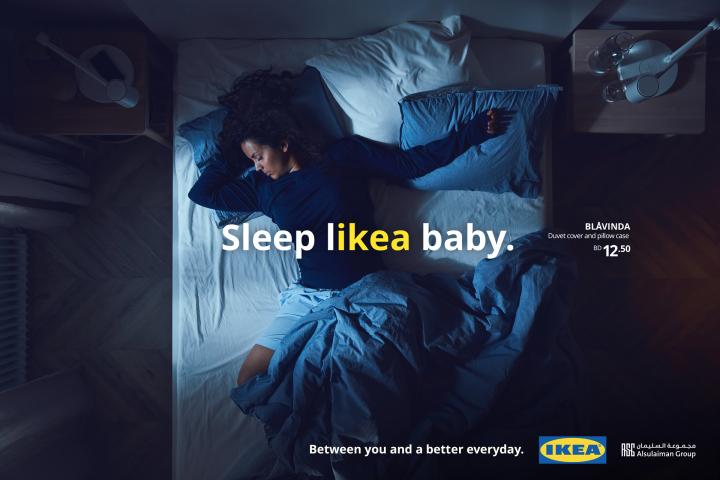LIKEA — IKEA Woman asleep on an unmade bed with text overlay "sleep likea baby" with "likea" in yellow