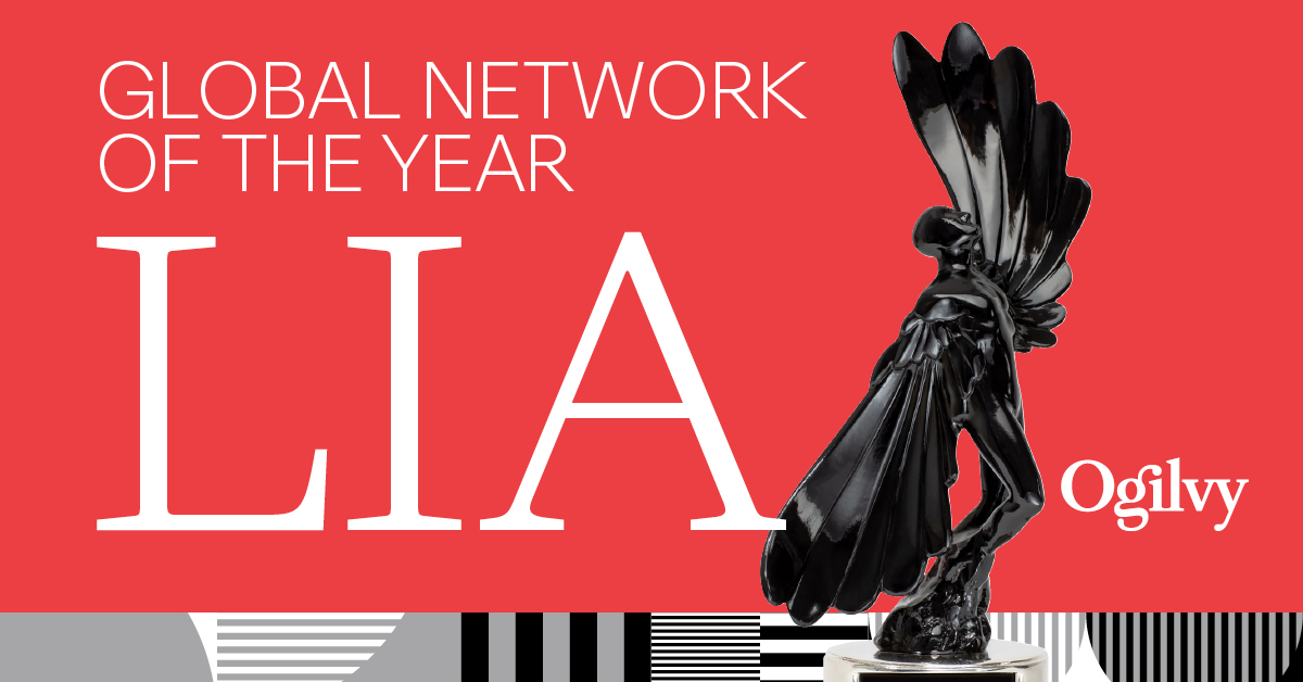 A red graphic announces "GLOBAL NETWORK OF THE YEAR" and "LIA" in large white text. On the right, a glossy black winged trophy stands next to the white "Ogilvy" logo. The bottom of the graphic features a geometric pattern of black, white, and gray stripes and shapes.