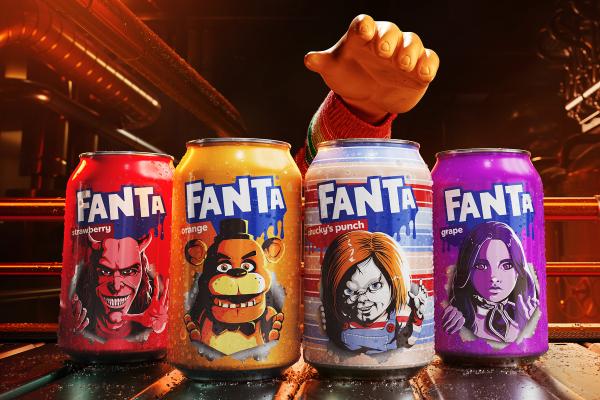 Global Fanta Halloween — Fanta Four Fanta soda cans, each featuring a different horror-themed character, are lined up on a dark, wet, industrial surface. From left to right, the cans are: red "strawberry" with a devil-like face, orange "orange" with Freddy Fazbear, light blue "Chucky's punch" with Chucky, and purple "grape" with a female character resembling Wednesday Addams. A large, cartoonish hand in a striped sleeve reaches down from the top right, as if to grab a can. The background is dark and blurry with industrial pipes and light
