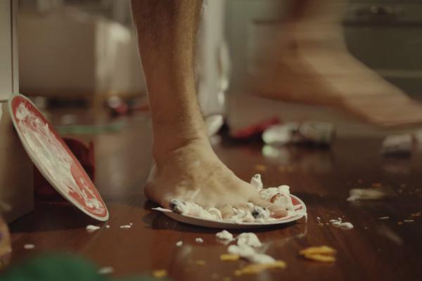 When the Festivities Are Over — AAMI Bare foot stepping on a messy paper plate indoors