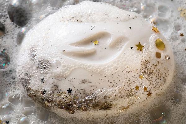 Unready for Anything — Dove Dove soap bar with suds and pieces of gold confetti on it