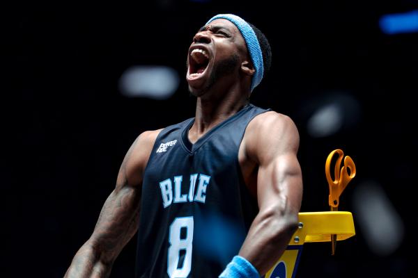 It Takes More to Get This Far — Powerade Basketball player in navy blue jersey and headband yelling in celebration