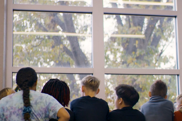 Windex - Windows of Opportunity Children at school looking out a large wall of windows