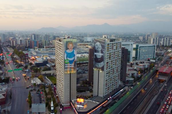 Raising Billboards — Milo Image from above of two large billboards on the side of skyscrapers in a city. Onone billboard is a Nike ad featuring a well-known athlete. On the other billboard is a MILO ad featuring that same athlete but as a child.
