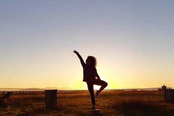 King Star — Cerveza Sol Silhoutted young person standing in a dance-like posde with one leg angled and one arm in the air