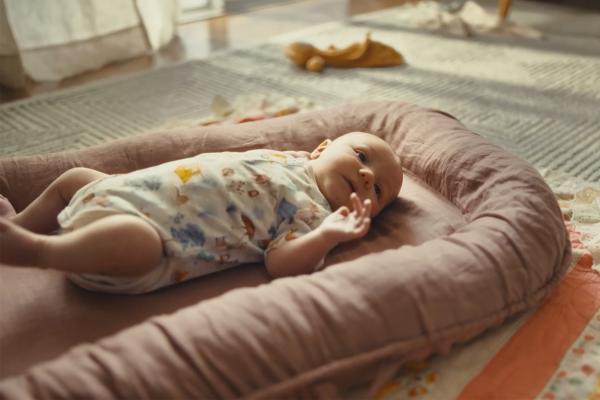 Newborn Parents — Gidget Foundation Australia Baby laying on an infant mattress