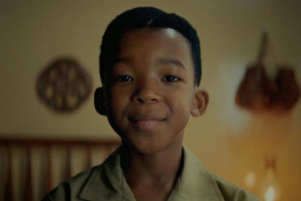 Real Mzansi Names — Cadbury Close up of a young Black South African boy smiling