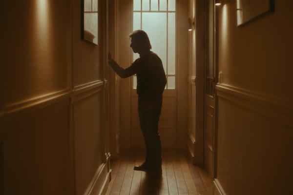 It's Me — Vicki Bernadet Foundation Silhoutted person in a hallway reaching for a door